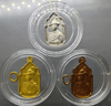 A set of three commemorative coins (silver, brass, copper) for the 5th cycle birthday anniversary of King Rama IX in 1987. Rare. Comes with a box.