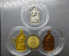 A set of three commemorative coins (silver, brass, copper) for the 5th cycle birthday anniversary of King Rama IX in 1987. Rare. Comes with a box.