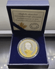 A commemorative coin celebrating the 88th birthday of King Rama IX, made of polished silver with partial plating of real gold, complete with original box and all accessories.