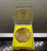 Bronze coin commemorating the construction of Rajaphibat Hospital, image of King Rama IX, back side B.P.R., size 3 cm, year 1996, original case