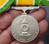 Medallion decorated with ribbon, King Rama IX, commemorating the 25th anniversary of the accession to the throne, 1971, silver (female model)