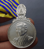 Commemorative coin decorated with a ribbon, Rama IX, on the occasion of the 7th Cycle Birthday Anniversary, 2011 (male model)