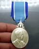 A commemorative medal decorated with a ribbon, celebrating the 60th birthday anniversary of Her Majesty Queen Sirikit, 2004, "Male Model"
