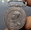 A commemorative medal decorated with a ribbon, commemorating the coronation ceremony of King Prajadhipok (Rama VII), 1925.