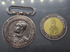 A commemorative medal decorated with a ribbon, commemorating the coronation ceremony of King Prajadhipok (Rama VII), 1925.