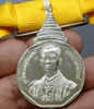 A commemorative coin decorated with a ribbon, from the Royal Coronation Ceremony of His Majesty King Rama IX, 1988. Rare, few made (female model).