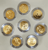 A set of 8 commemorative coins, 8 days of birth, made of cupronickel, gold plated, packed in a leather box with a certificate from the Treasury Department.