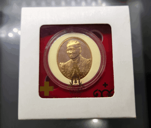 Bronze coin featuring the image of King Rama IX on the front and the Royal Monogram (ภปร) on the back, commemorating the 100th anniversary of Chulalongkorn Hospital, Thai Red Cross Society. Comes with original box.