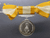 A commemorative coin decorated with a ribbon, commemorating the coronation ceremony of the Crown Prince, 1972, female type