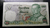 A rare, uncirculated 20-baht banknote, 12-digit serial number, from the reign of King Rama IX, minted in 1981 (B.E. 2524).