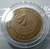 Blackened bronze medal from the 18th SEA Games, size 3.5 cm.