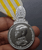 A commemorative medal decorated with a ribbon, in honor of the coronation ceremony of King Rama X, male style.