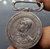 A commemorative medal decorated with a ribbon, commemorating the coronation ceremony of King Prajadhipok (Rama VII), 1925.