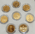 A set of 8 commemorative coins, 8 days of birth, made of cupronickel, gold plated, packed in a leather box with a certificate from the Treasury Department.