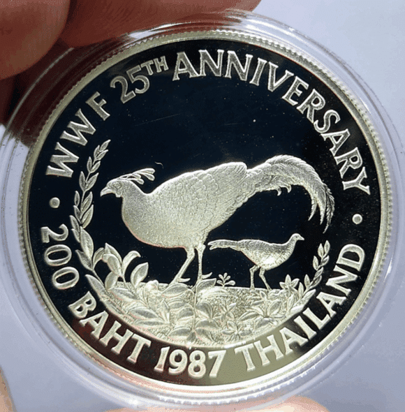 200 Baht polished silver commemorative coin, 25th Anniversary of the World Wildlife Fund, Pheasant design, 1987, with certificate. Excellent condition.