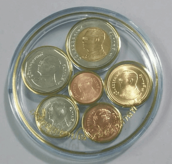 Complete set of King Rama IX coins (6 coins, uncirculated) in a round acrylic case.
