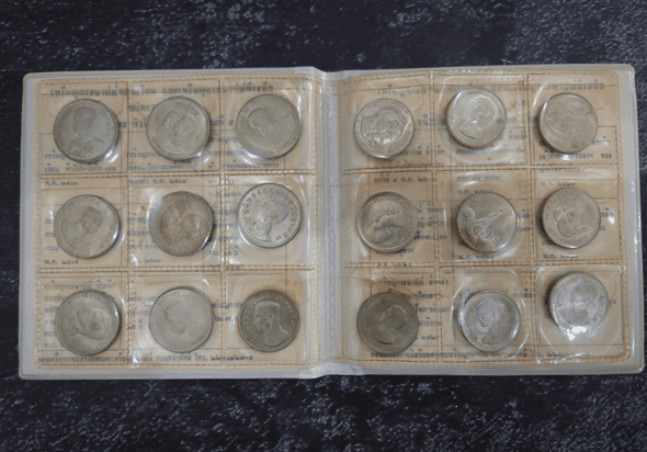 Complete set of 18 1-baht coin albums, leather-bound, from the Royal Thai Mint. Uncirculated (limited production).