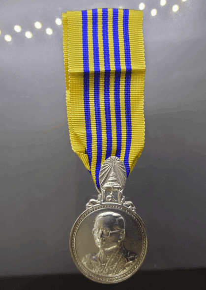 Commemorative coin decorated with a ribbon, Rama IX, on the occasion of the 7th Cycle Birthday Anniversary, 2011 (male model)