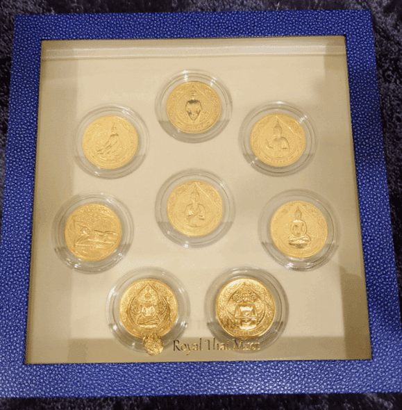 A set of 8 commemorative coins, 8 days of birth, made of cupronickel, gold plated, packed in a leather box with a certificate from the Treasury Department.