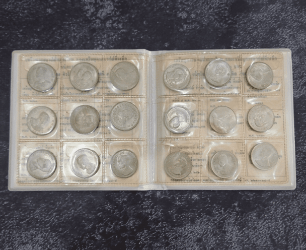 Complete set of 18 1-baht coin albums, leather-bound, from the Royal Thai Mint. Uncirculated (limited production).