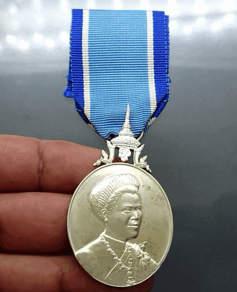 A commemorative medal decorated with a ribbon, celebrating the 60th birthday anniversary of Her Majesty Queen Sirikit, 2004, "Male Model"