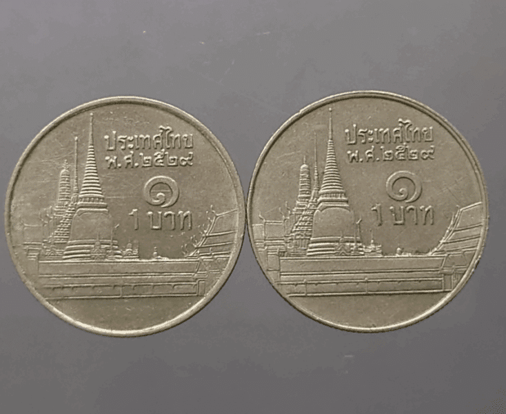A pair of 1 baht coins, circulating "short gable - long gable", 1986, slightly used, good condition.