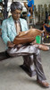 Man Reading a Newspaper - with Bronze Bench