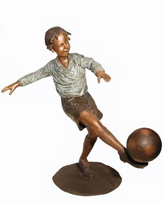 Young Boy Playing Soccer