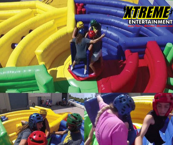 "Dizzy X inflatable obstacle course with participants navigating spinning challenges"