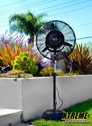 "24-inch outdoor misting fan providing cool air for a patio or outdoor event"