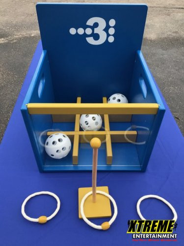 "3 in a Row carnival game with participants aiming to win at a festival"