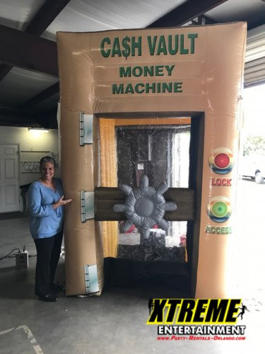 "Mega Cash Vault experience where participants grab floating cash at a promotional event"