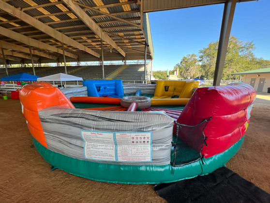 "Hungry Hungry Hippo inflatable game for kids at an outdoor event"