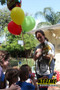 "Child interacting with a squirrel monkey during a hands-on animal encounter"