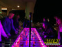 "Interactive 8-person LED foosball table lit up for nighttime outdoor event"