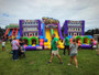 "Funhouse Super Obstacle Course with kids racing through colorful inflatable obstacles"