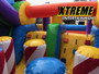"Funhouse Super Obstacle Course with kids racing through colorful inflatable obstacles"