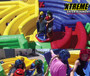 "Dizzy X inflatable obstacle course with participants navigating spinning challenges"
