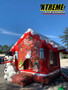 "Snowman house combo with a slide for kids at a holiday event"