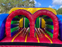 35ft Obstacle Challenge inflatable course for rent — a high-energy adventure with climbing walls, tunnels, and slides, ideal for school events and festivals.