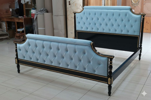 Blue tufted French bed