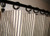 Black and white ticking curtain with ring clips