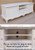 WHITE TV UNIT ALSO USED AS A SIDEBOARD