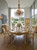 OVAL DINING SET WITH A DISTRESSED CREAM PATINA FINISH