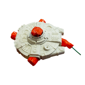 Journey to a galaxy far, far away with this spinning plastic novelty. The engines scream with red, green, and gold sparks. 