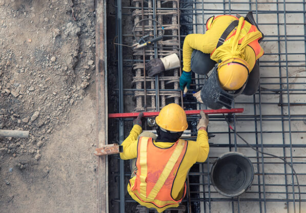 Construction Crew Laying Rebar