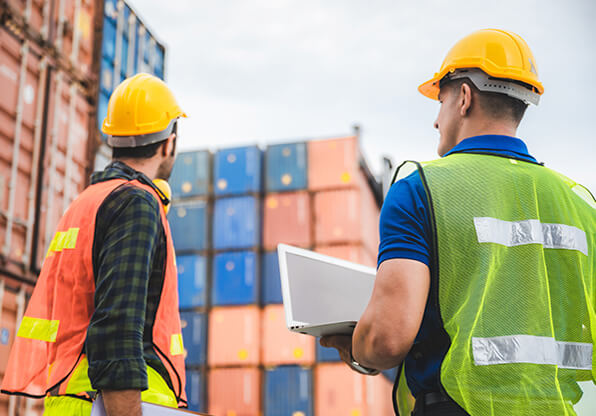 Dock Workers Inspect Shipments