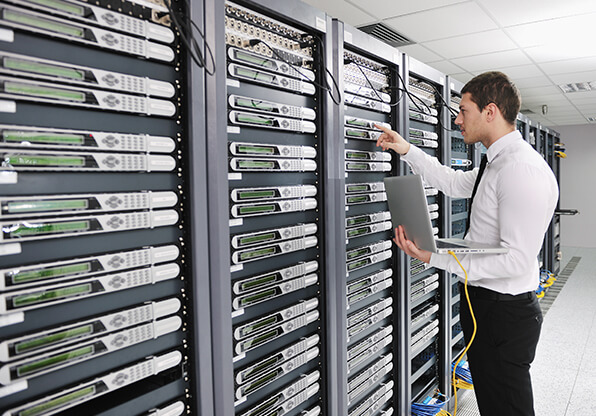 IT guy inspects server rack