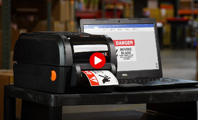 LabelTac Pro X printer on mobile cart printing a danger label using LabelSuite