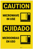 Caution: Microwave in Use with Icon Bilingual Spanish - Label